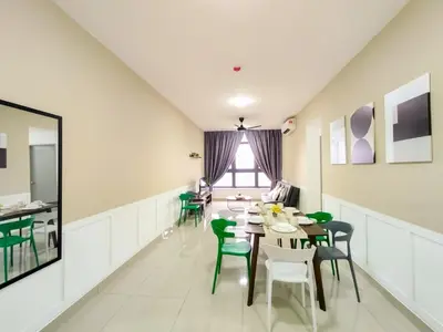 a dining room with tables and green chairs at M Vertica By Minsu in Kuala Lumpur