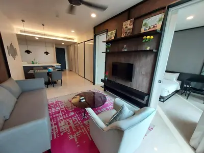 a living room with a couch and a fireplace at Kuala Lumpur City Center Tropicana The Residence in Kuala Lumpur