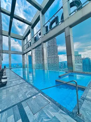a large swimming pool on the top of a building at Kuala Lumpur City Center Tropicana The Residence in Kuala Lumpur