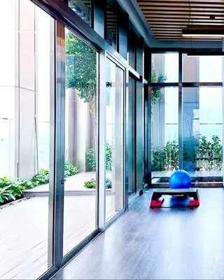 an office with a large glass door and a yoga ball at Kuala Lumpur City Center Tropicana The Residence in Kuala Lumpur