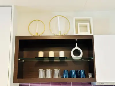 a shelf with two mirrors and blue vases at Kuala Lumpur City Center Tropicana The Residence in Kuala Lumpur