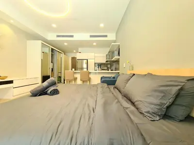 a large bed in a large room with a kitchen at M city service suite KLCC in Kuala Lumpur