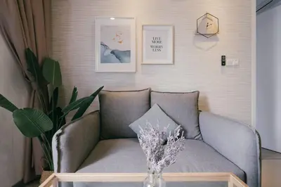 a living room with a couch and a vase on a table at Muji Home 2BR 4Pax Southlink Nexus Bangsar South in Kuala Lumpur
