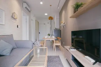 a living room with a couch and a large flat screen tv at Muji Home 2BR 4Pax Southlink Nexus Bangsar South in Kuala Lumpur