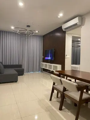 a living room with a dining table and a tv at Datum Jelatek Sky Residence KLCC SkyRing Linked to LRT and Mall in Kuala Lumpur