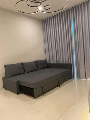 a couch in a living room with a ceiling at Datum Jelatek Sky Residence KLCC SkyRing Linked to LRT and Mall in Kuala Lumpur