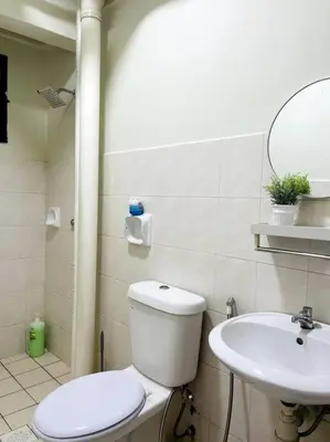 a bathroom with a toilet and a sink at Suasana Stay & Homestay Sentul Utama Kuala Lumpur 3R3BR 2AC 2 Car park-Netflix-WIFI-Pool View in Kuala Lumpur