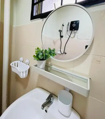 a bathroom with a mirror and a sink at Suasana Stay & Homestay Sentul Utama Kuala Lumpur 3R3BR 2AC 2 Car park-Netflix-WIFI-Pool View in Kuala Lumpur