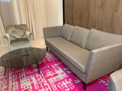 a living room with a couch and a coffee table at Tropicana The Residences By RS in Kuala Lumpur