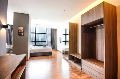 a large room with a bedroom and a bed at Bangsar Trade Centre by Airhost in Kuala Lumpur