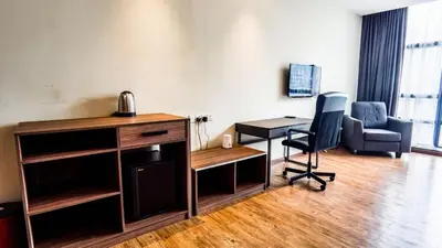an office with a desk and a chair and a table at Bangsar Trade Centre by Airhost in Kuala Lumpur