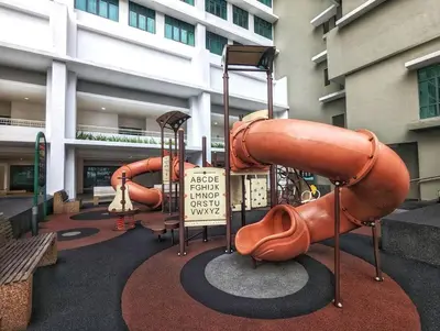 a playground in front of a building at Legasi 3-bedroom condo - 5 mins walk to KLCC in Kuala Lumpur
