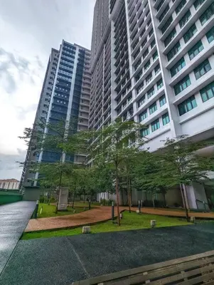 a large building with a park in front of it at Legasi 3-bedroom condo - 5 mins walk to KLCC in Kuala Lumpur