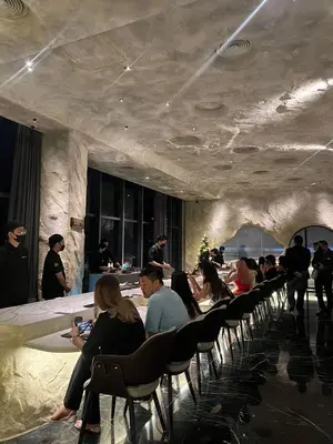 a group of people sitting in chairs in a room at Star Sky Park KLCC in Kuala Lumpur