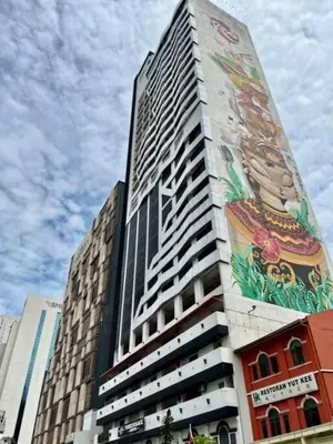 a tall building with a mural on the side of it at #211 M101 Dang Wangi KLCC View Pool By Livin in Kuala Lumpur