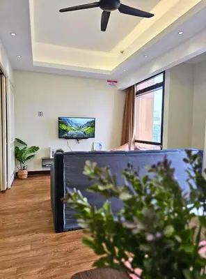 a living room with a ceiling fan and a couch at Homestay Heart of Bukit Bintang Walk to Monorail & LRT St by Cloud Host in Kuala Lumpur