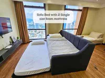 a sofa bed with single size room mattress at Homestay Heart of Bukit Bintang Walk to Monorail & LRT St by Cloud Host in Kuala Lumpur