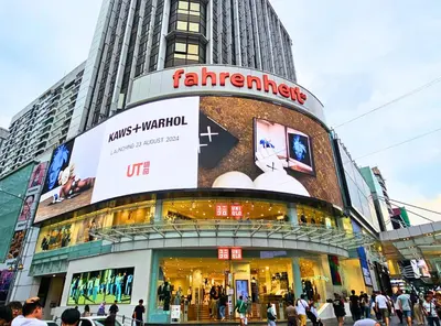 a store in a city with people walking in front of it at Homestay Heart of Bukit Bintang Walk to Monorail & LRT St by Cloud Host in Kuala Lumpur