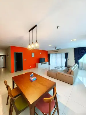 a living room with a table and a couch at Summer Suites by Moon Orchid in Kuala Lumpur