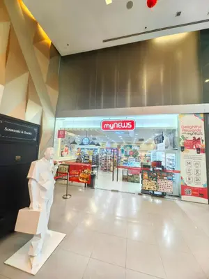 a store with a statue of a man in a store at Summer Suites by Moon Orchid in Kuala Lumpur