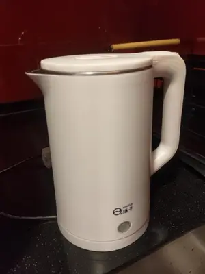 a white slow cooker sitting on top of a counter at Arcoris Soho 1-4PAX COZY HOME in Kuala Lumpur