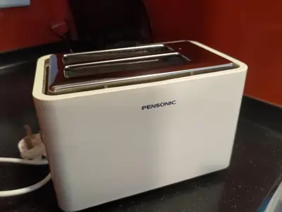 a white toaster sitting on top of a counter at Arcoris Soho 1-4PAX COZY HOME in Kuala Lumpur