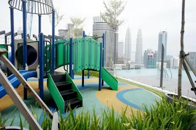a playground with a slide in a city at Maxhome Premium at Dorsett Bukit Bintang in Kuala Lumpur