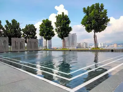 a swimming pool with trees and a city in the background at M Vertica Residence I HomeBrickz in Kuala Lumpur