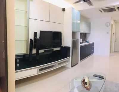 a living room with a flat screen tv on a wall at Kuala Lumpur Bukit Bintang LaLaport Serviced Suite KLCC in Kuala Lumpur