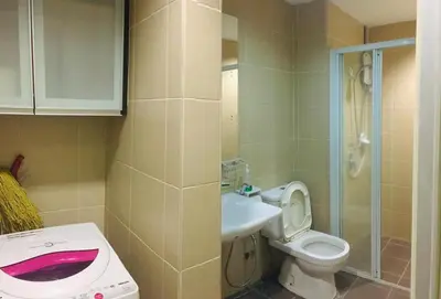 a small bathroom with a toilet and a sink at Kuala Lumpur Bukit Bintang LaLaport Serviced Suite KLCC in Kuala Lumpur