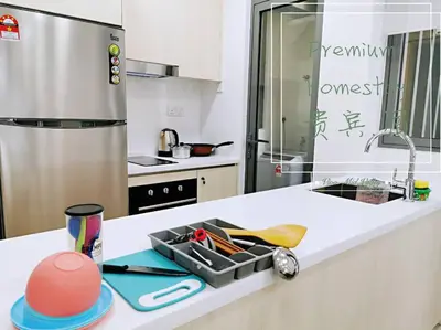 a kitchen with a counter with a tray of utensils at Mid Valley - Vivo Residence Center Of KL 6-8Pax in Kuala Lumpur