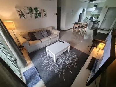 a living room with a couch and a coffee table at 1 min Next to LRT CHERAS 68 with Shared Area in Kuala Lumpur