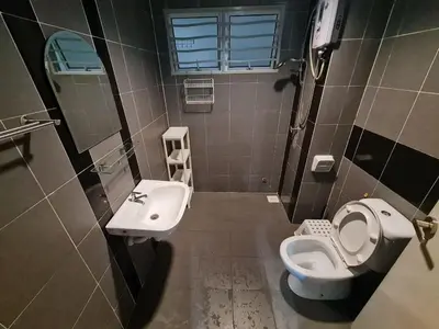 a bathroom with a toilet and a sink at 1 min Next to LRT CHERAS 68 with Shared Area in Kuala Lumpur