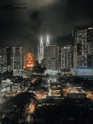 a city lit up at night with buildings at The Colony By Infinitum Best Pool View KLCC TRX Merdeka 118 KL Tower in Kuala Lumpur