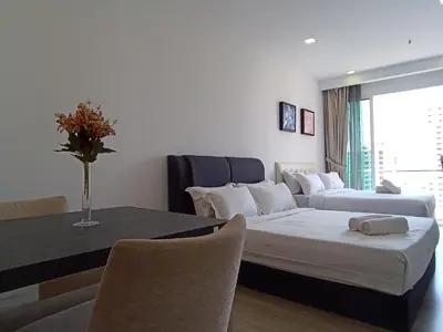 a living room with a couch and a table at RM020 Bukit Bintang 118 Tower Balcony View in Kuala Lumpur