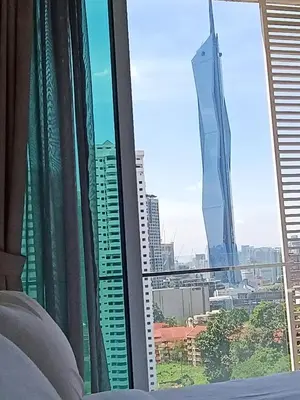 a view of a city from a hotel window at RM020 Bukit Bintang 118 Tower Balcony View in Kuala Lumpur