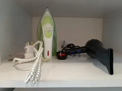 a shelf with a surfboard and a gun and a rope at RM020 Bukit Bintang 118 Tower Balcony View in Kuala Lumpur