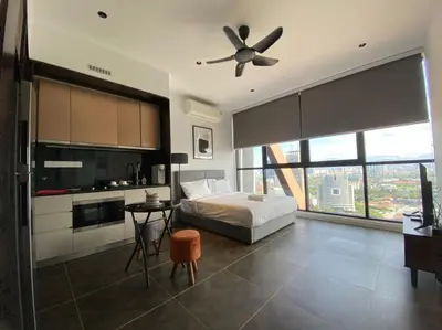 a bedroom with a bed and a ceiling fan at Infini Suites@ Scarletz Suites KLCC in Kuala Lumpur