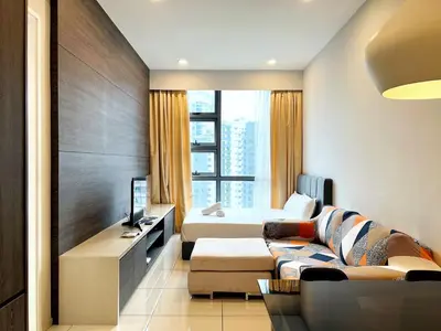 a hotel room with a couch and a bed at Orion Suites@ The Robertson Bukit Bintang in Kuala Lumpur