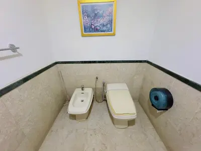 a bathroom with a toilet and a sink at Times Square East privite service Apartment in Kuala Lumpur