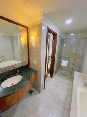 a bathroom with a sink and a shower at Times Square East privite service Apartment in Kuala Lumpur