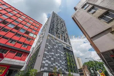a tall building in the middle of a city at Chambers Premier Suites Kuala Lumpur in Kuala Lumpur