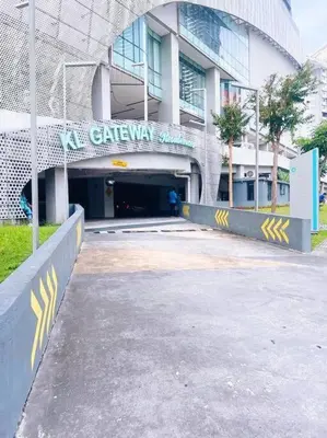 a building with a tunnel in front of it at [Promo] Connected Train 2 Bedroom (ABOVE MALL) 28 in Kuala Lumpur