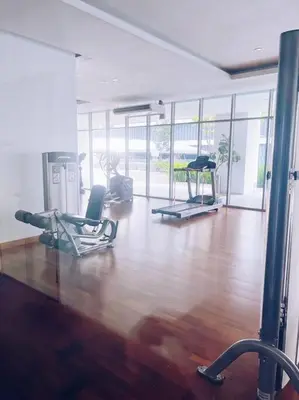 a gym with two chairs and a wooden floor at [Promo] Connected Train 2 Bedroom (ABOVE MALL) 28 in Kuala Lumpur