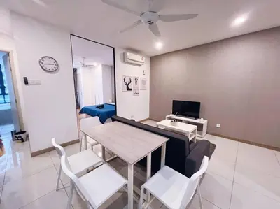 a living room with a couch and a table and chairs at [Promo] Connected Train 2 Bedroom (ABOVE MALL) 28 in Kuala Lumpur