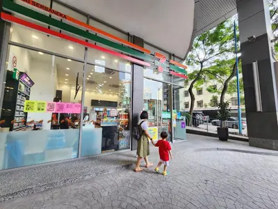 a woman and a child standing outside of a store at 1-6px Bukit Bintang 1min walk to Lot10 Pavilion in Kuala Lumpur
