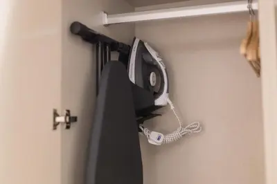 a tv hanging on a wall with a phone at Atelier Bukit Bintang in Kuala Lumpur