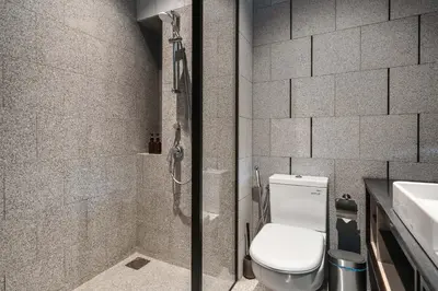 a bathroom with a toilet and a sink at Scarletz KLCC Apartments by soulasia in Kuala Lumpur