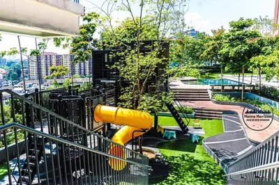a playground with a slide in a park at Premium Suites by Home Horizon at Lucentia Residence in Kuala Lumpur