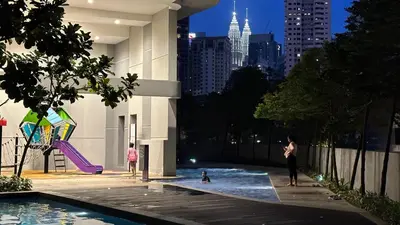 a group of people playing in a pool in a city at The Robertson Residence Bukit Bintang 20F in Kuala Lumpur